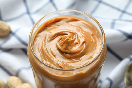 Jar With Creamy Peanut Butter On Napkin