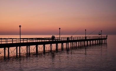 Fototapeta na wymiar Morning fishing from the pier, Cyprus.
