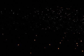 красивый блестящий фон с бликами и блестками  на темном  фоне         