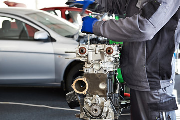 Repair of engine in car workshop