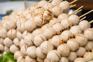 Grilled Meatballs in street market.Thailand.