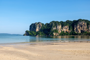 Railay west beach with mountain and long tail boat