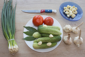 Cucumber. Include fresh organic vegetables on wooden floor. Fresh, raw vegetables on the table