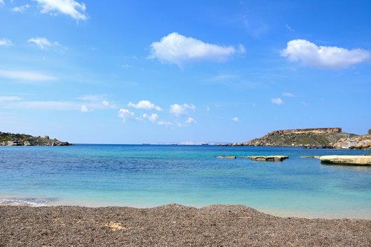 View of Ghaja Tehheiha Bay with a pebble beach in the foreground, Ghajn Tuhheiha Bay, Malta.