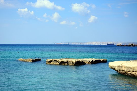 View of Ghaja Tehheiha Bay with the rocky coastline in the foreground, Ghajn Tuhheiha Bay, Malta.