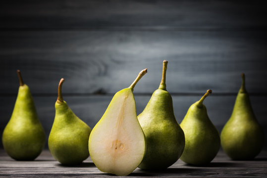 Fresh pears over wooden background
