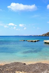Obraz premium View of Ghaja Tehheiha Bay with a pebble beach in the foreground, Malta.