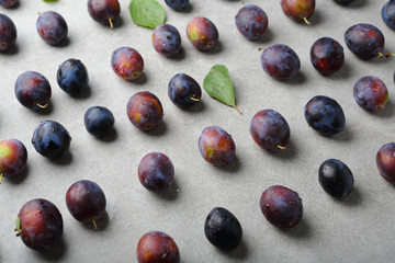 Plums pattern on concrete background