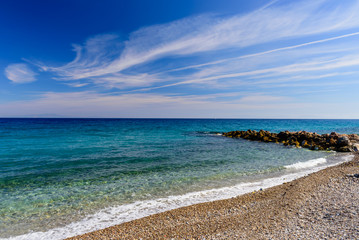 A beautiful pebbly beach in the village of Karlovasi, Samos island, Greece