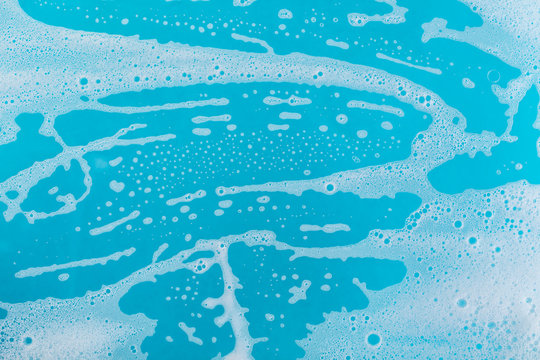 Soap Foam On A Blue Background