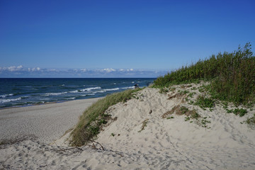 Fototapeta na wymiar Deserted seascape on the Baltic sea and sand dunes
