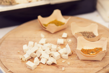 a person cut a cheese in the cheese market.