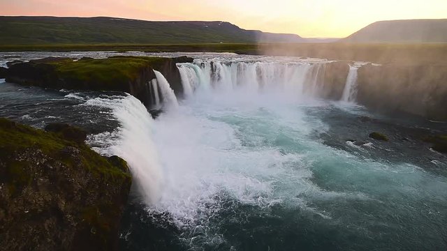 Fantastic sunset. Godafoss very beautiful Icelandic waterfall 12 meters high. It is located in the north near Lake Myvatn.