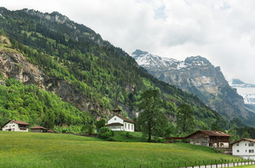 Fototapeta na wymiar Church in the background of mountains