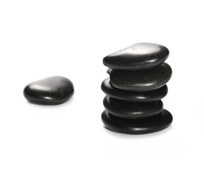 Pile black rocks isolated on white background and texture