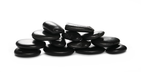Pile black rocks isolated on white background and texture