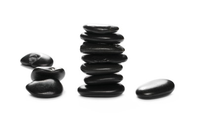 Pile black rocks isolated on white background and texture