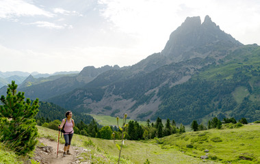 woman hiker with Pic du Midi d'Ossau in the French Pyrenees