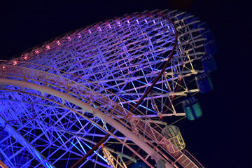 Night view of the colorful illuminations of the Ferris wheel