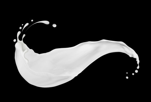 Splashes of cream or milk close-up on black