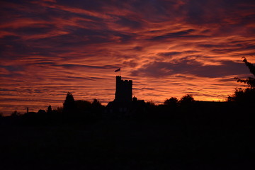 Obraz premium Village church sunset