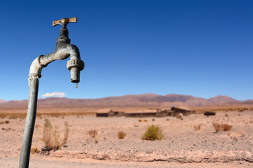 Drips faucet and dry environment in the background - 170026531