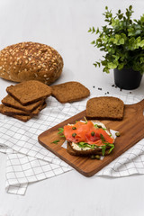 Salmon Sandwich on wooden plate