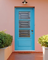 elegant house blue door on pink wall, Athens Greece