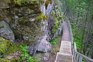 Fototapeta premium Magic road along the mountains. Natural Park Deer Streams, Sverdlovsk oblast, Russia.