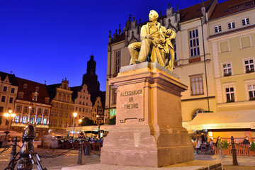 WROCLAW, POLAND - JUNE, 2017: Statue of the Polish poet, playwright and comedy writer Aleksander Fredro in the Market Square in front of the Town Hall of Wroclaw - Poland. - obrazy, fototapety, plakaty