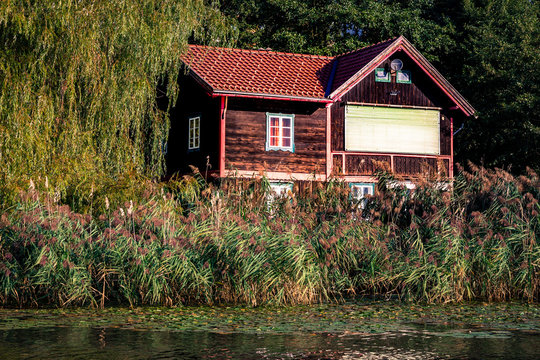 wooden house by the lake in Autria