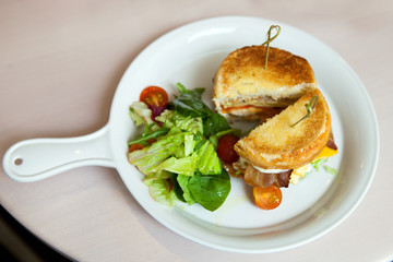 A cuted burger on white plate