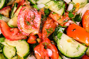 Background of salad with cucumbers and tomatoes