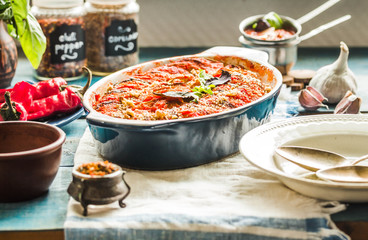 Tasty vegetarian ratatouille made of eggplants, squash, tomatoes and onions.
