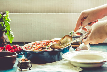 Ratatouille in a crockery on blue rustic background, serving a meal. .Classic French stew of autumn...