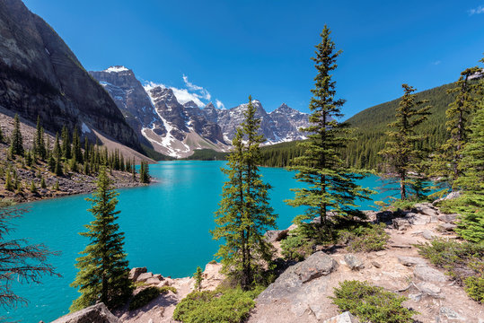Beautiful turquoise waters of the Moraine lake with snow-covered peaks in Banff National Park, Canada.