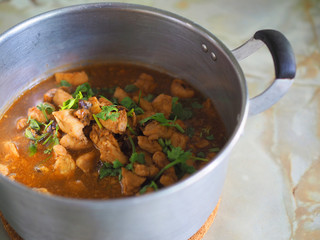 Boiled chicken with soy sauce gravy in aluminum pot