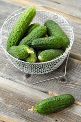 Fresh green cucumbers in a beautiful basket