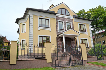 Fototapeta na wymiar Modern two-storeyed cottage in Kaliningrad