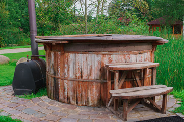 Fototapeta premium a barrel with heated water, for taking water procedures,