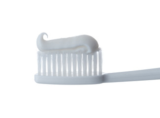 Toothpaste being with toothbrush on a white background