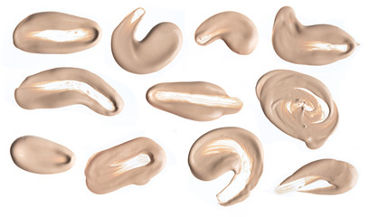 Collection of various make up liquid foundation stroke on white background
