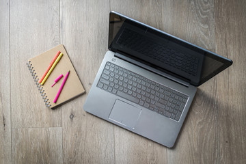 laptop and writing notebook, business working