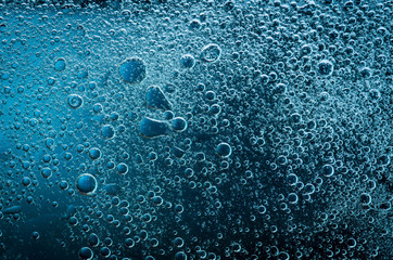 Complementary colors oil drops and water drops on glass,abstract background