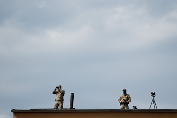 Polish soldiers on the building roof.