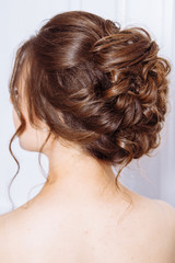 Fototapeta premium Rear view of a beautiful wedding hairstyle