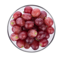 Ripe red grape in bowl on white background