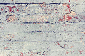 Brick wall with blue paint.