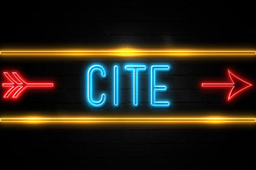 Cite  - fluorescent Neon Sign on brickwall Front view