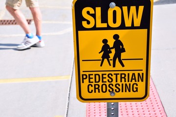 Slow pedestrian crossing sign.